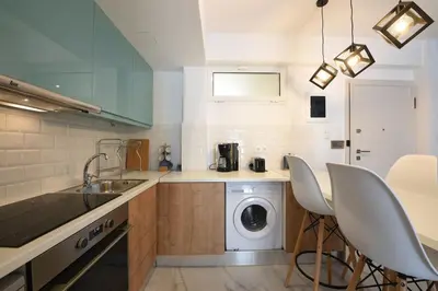 a kitchen with a sink and a washing machine at 3 mins walking from Acropolis in Athens