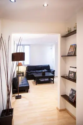 a living room with a couch and a table at Athens Best location, 6 Ermou street, Syntagma square in Athens