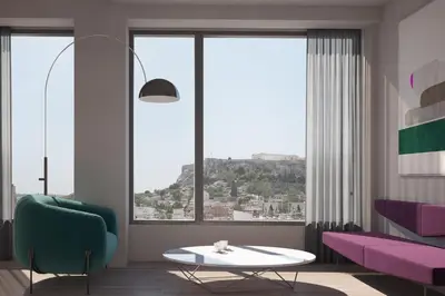 a living room with a table and a large window at Athens Utopia Ermou in Athens