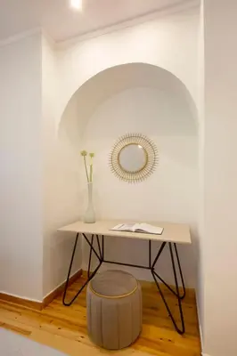 a table with a stool and a mirror on a wall at Glyfada Villa 6BR 16ppl Private Pool 300m to Beach in Athens