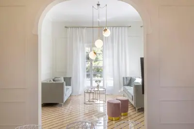 a living room with an archway leading to a living room at Glyfada Villa 6BR 16ppl Private Pool 300m to Beach in Athens
