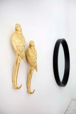 two gold bird hooks on a wall with a mirror at Glyfada Villa 6BR 16ppl Private Pool 300m to Beach in Athens
