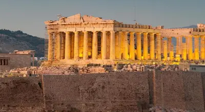 a building with yellow columns in front at ACROPOLITANA 2 in Athens