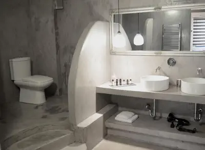 a bathroom with a sink and a toilet and a mirror at BEAUTIFUL PEOPLE SUITES ATHENS ACROPOLIS VIEW in Athens