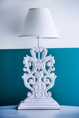 a white lamp sitting on top of a table at Rastoni Athens Suites near Acropolis at Tsatsou street in Athens