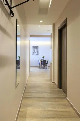 a hallway leading to a dining room in a house at More Athens Apartments in Athens