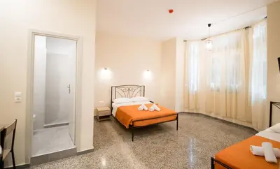 a bedroom with a bed and a walk in shower at Athens Psiri Hotel in Athens