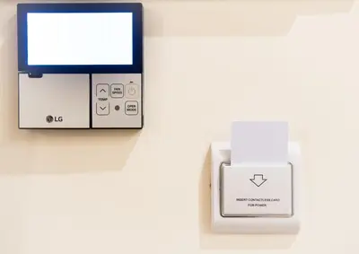 an electronic device with a box next to a monitor at Athens Psiri Hotel in Athens