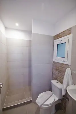 a bathroom with a toilet and a sink at Athens Psiri Hotel in Athens