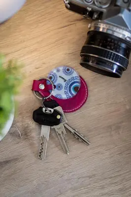 a table with a pair of keys and a camera at Paradise apartment in Koukaki in Athens