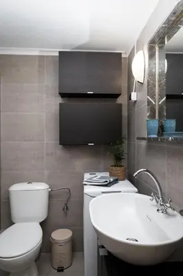 a bathroom with a white toilet and a sink at Paradise apartment in Koukaki in Athens
