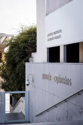 a sign on the side of a building at Paradise apartment in Koukaki in Athens