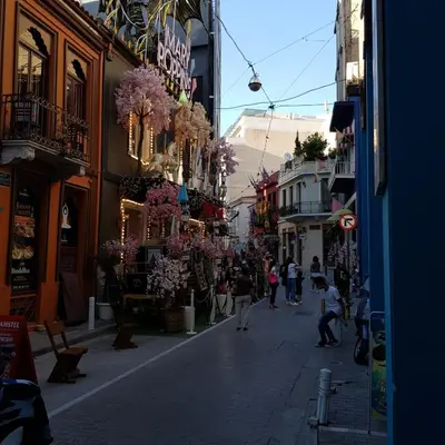 a city street with people walking down a street at Kanigos 3 BR VIEW Center of Athens in Athens