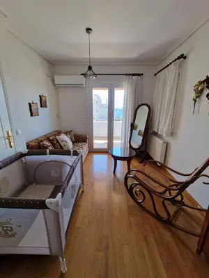 a living room with a couch and a mirror at The Mirador Boutique Villa with Scenic Sea View in Porto Rafti