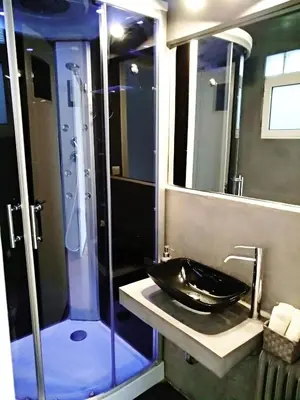 a bathroom with a black sink and a shower at The Athens Museum Penthouse 120sqm Lycabettus View in Athens