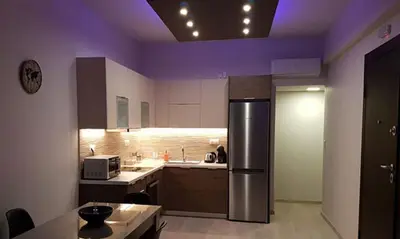 a kitchen with a stainless steel refrigerator and purple ceilings at MiCasa SuCasa / Heart of Athens / Brand-New superlux in Athens