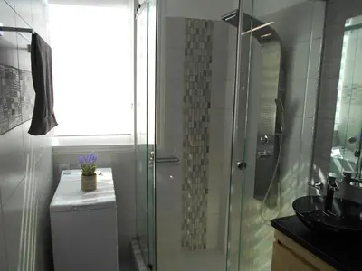a bathroom with a shower and a toilet and a sink at MiCasa SuCasa / Heart of Athens / Brand-New superlux in Athens