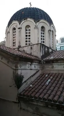 an old building with a cross on top of a roof at MiCasa SuCasa / Heart of Athens / Brand-New superlux in Athens