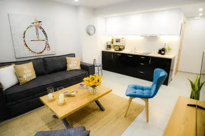 a living room with a couch and a table at Your Home Away from Home in Erectheium in Athens