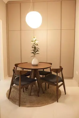 a table with two chairs and a vase with a plant at Chic & Comfortable Central Apart, close to National Archeological Museum! in Athens
