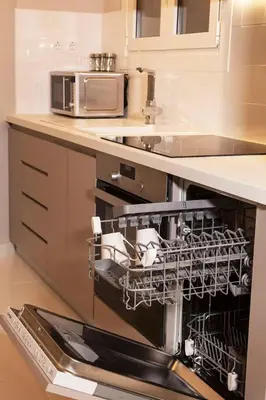 a kitchen with a dishwasher with dishes in it at Chic & Comfortable Central Apart, close to National Archeological Museum! in Athens