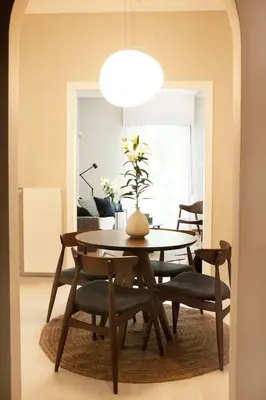 a dining room with a table and chairs at Chic & Comfortable Central Apart, close to National Archeological Museum! in Athens