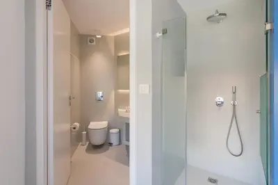 a bathroom with a shower and a toilet at Athens Color Cube in Athens