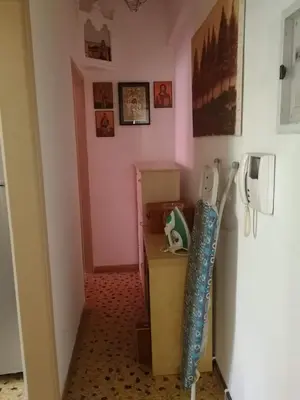 a hallway with a refrigerator and a phone in a room at Galini in Athens