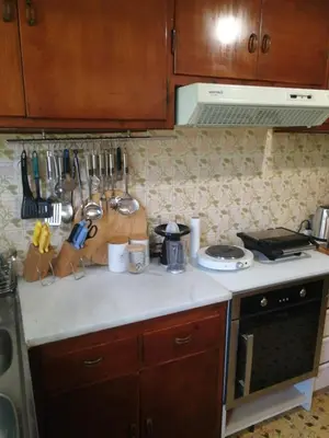a kitchen with a counter top with a stove top oven at Galini in Athens