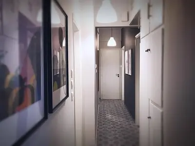 a hallway with pictures on the walls and a hallway with a hallwayngthngthngth at Victoria 5star / 5BR BigApt / Sauna / 2min to metro in Athens