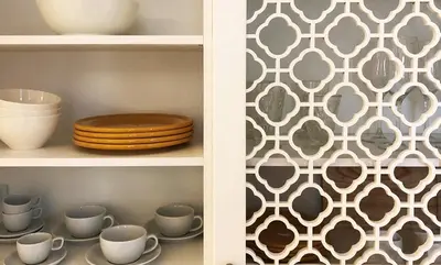 a shelf with cups and plates and a wall at Acropolis TownHouseCo Suites in Athens