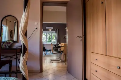 a hallway with a door leading to a dining room at ANAFIS COMFORT in Athens