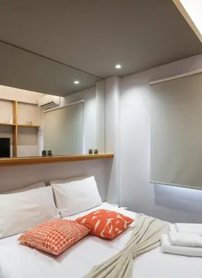 a bedroom with a bed with two pillows on it at Kolokotroni Lofts Syntagma in Athens