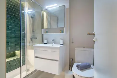 a bathroom with a toilet and a sink and a shower at Kolokotroni Lofts Syntagma in Athens