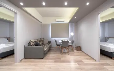 a room with a couch and a table and a bed at Kolokotroni Lofts Syntagma in Athens