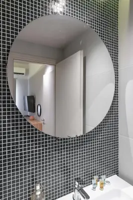 a bathroom with a mirror and a sink at Kolokotroni Lofts Syntagma in Athens