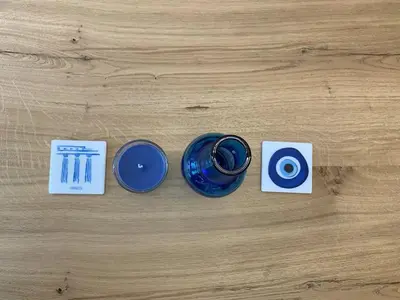 a table with a blue cup and some cards at CosmosDome / Best apartment in the heart of Athens ! in Athens