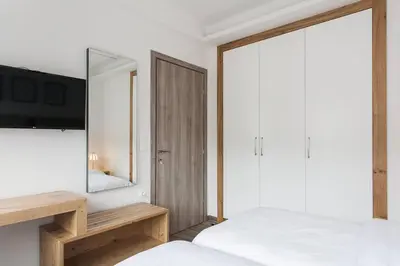 a bedroom with a large mirror and a bed at CosmosDome / Best apartment in the heart of Athens ! in Athens