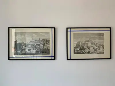 three framed pictures of a city on a wall at CosmosDome / Best apartment in the heart of Athens ! in Athens