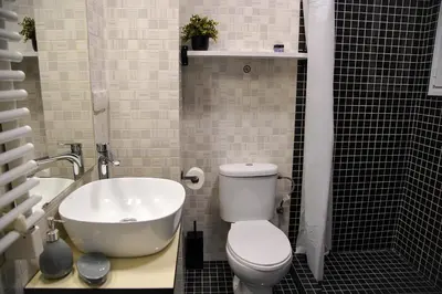 a bathroom with a sink and a toilet and a tub at Attiki Sunshine Apartment With Terrace VIPGreece in Athens