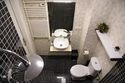 a bathroom with a white toilet and a sink at Attiki Sunshine Apartment With Terrace VIPGreece in Athens