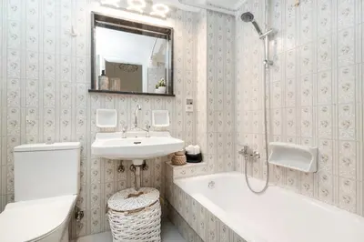 a bathroom with a sink and a tub and a toilet at Athena by Heloni Apartments in Athens