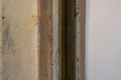 a wooden door with a metal frame next to a wall at Noma Hotel in Athens