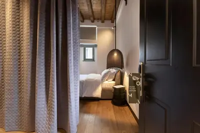 a room with a bedroom with a bed and a door at Noma Hotel in Athens