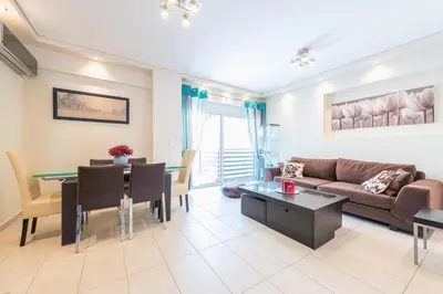a living room with a couch and a table at Comfortable,sunny apartment in Athens Center in Athens