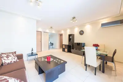 a living room with a couch and a table at Comfortable,sunny apartment in Athens Center in Athens