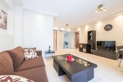 a living room with a couch and a coffee table at Comfortable,sunny apartment in Athens Center in Athens
