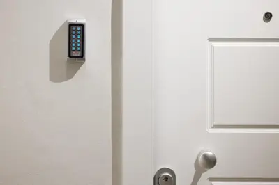 two pictures of a door with a remote control on it at Athenian Sensations Apartments and Suites in the Heart of Athens in Athens