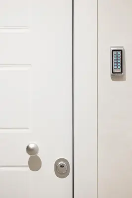 a white door with a handle and a button at Athenian Sensations Apartments and Suites in the Heart of Athens in Athens
