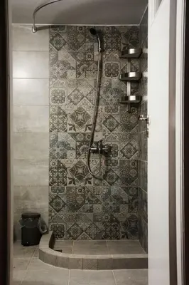 a bathroom with a shower with a stone wall at Vintage, spacious apartment in the heart of Athens! in Athens